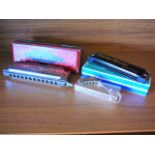 Hohner Chromatic Harmonica and two others