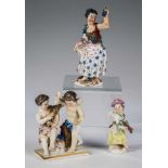 Drei Porzellanfigurenu.a. Meissen, um 19./20. Jh. Eine verkleidete Amorette, ein Paar musizierende