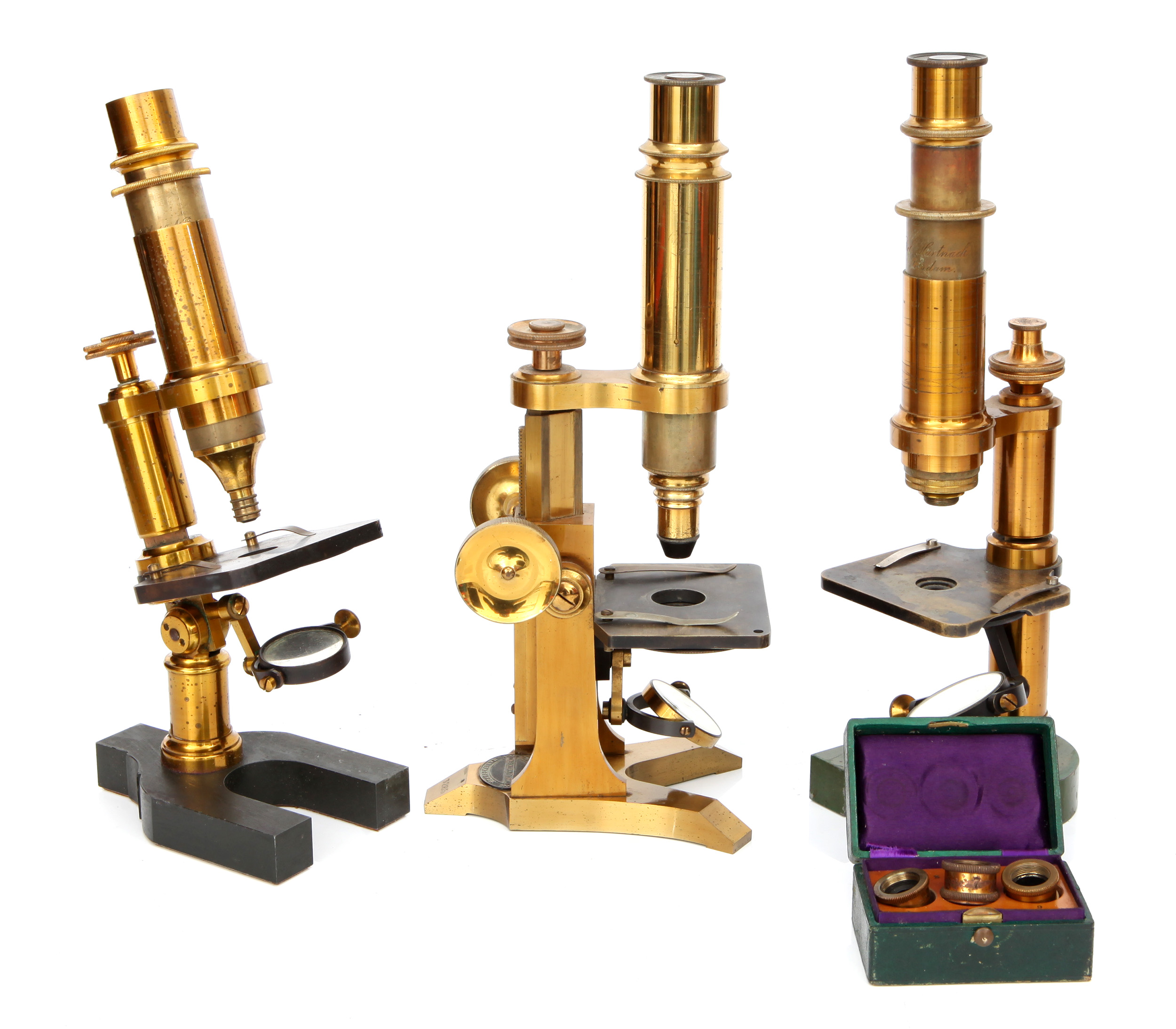 A Collection of three Cased Brass Microscopes,