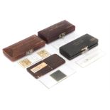 Four Cased Microscope Slides,