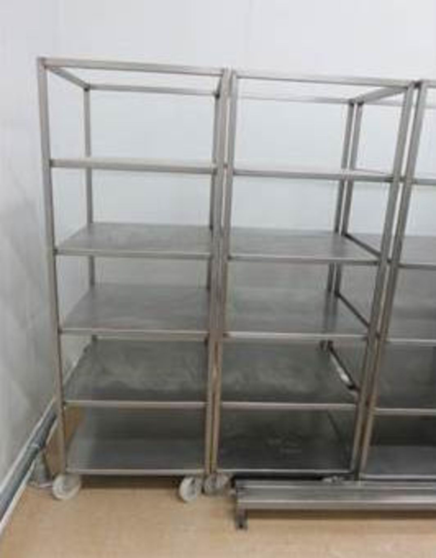 2 x S/s mobile trollies with 5 shelves. Approx. 600mm x 600mm x 1800mm high. Lift Out £10