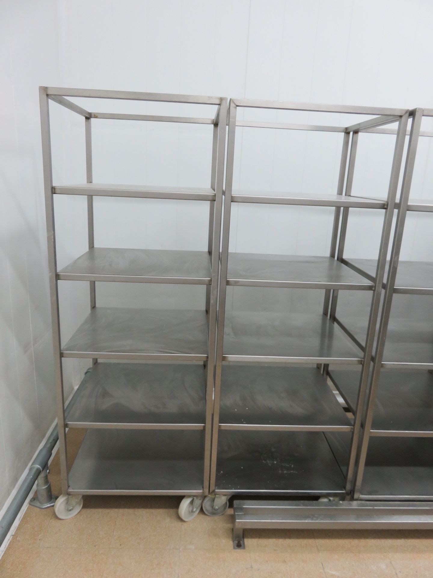 2 x S/s mobile trollies with 5 shelves. Approx. 600mm x 600mm x 1800mm high. Lift Out £50