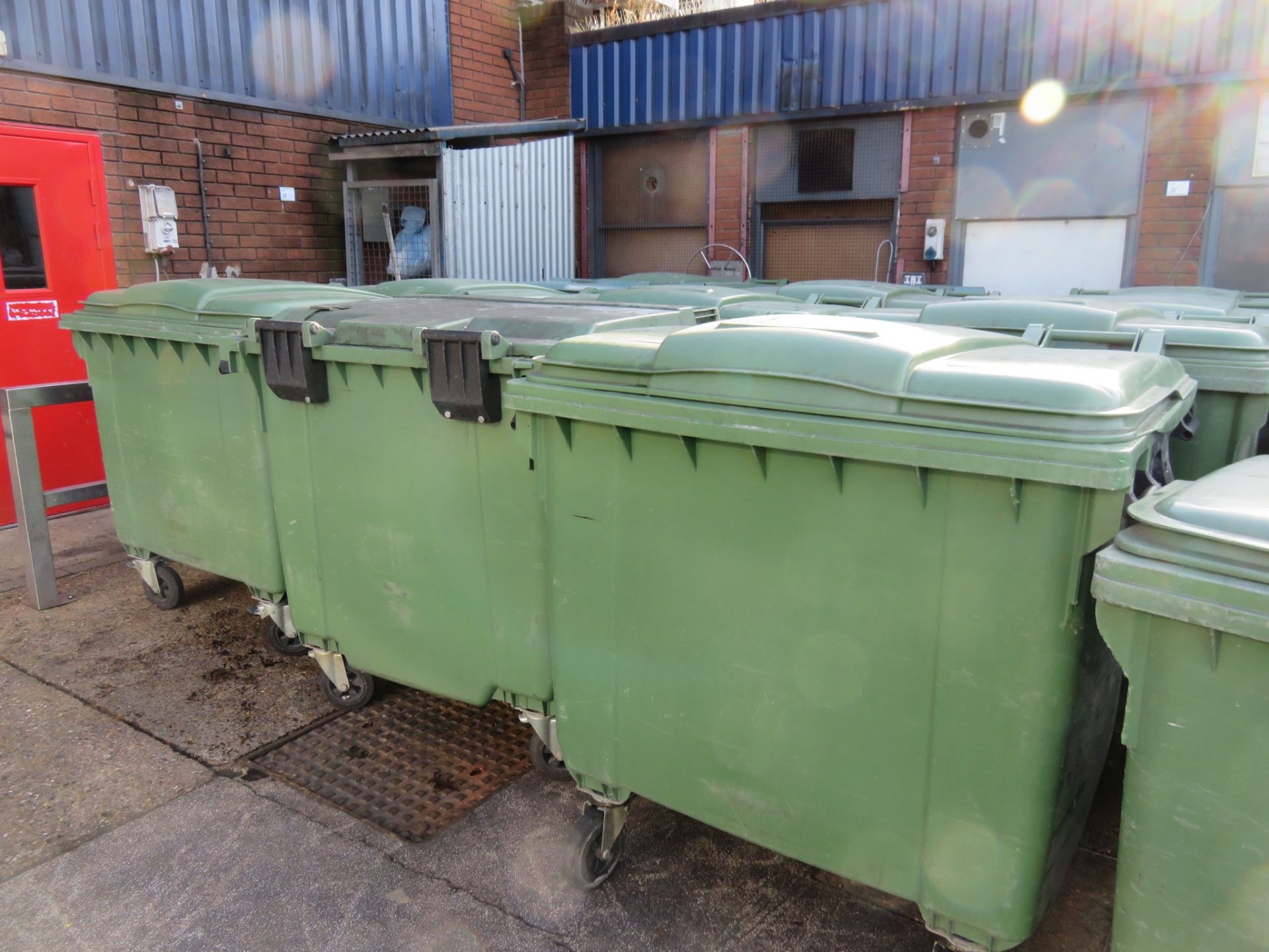 4 x Green Wheelie Bins 4 wheels some with lids. Approx. 700 x 1200 x 1100mm. Lift out charge £5