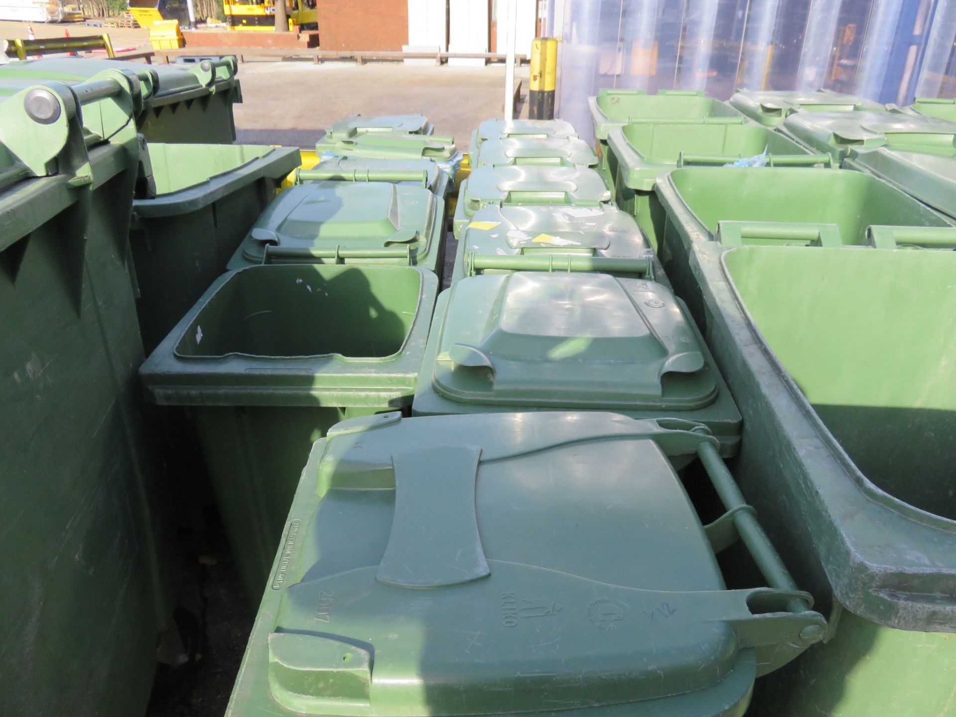 x 4 Green Wheelie Bins 2 wheels by Kilco some with lids. Approx. 400 x 400 mm. Lift out charge £5