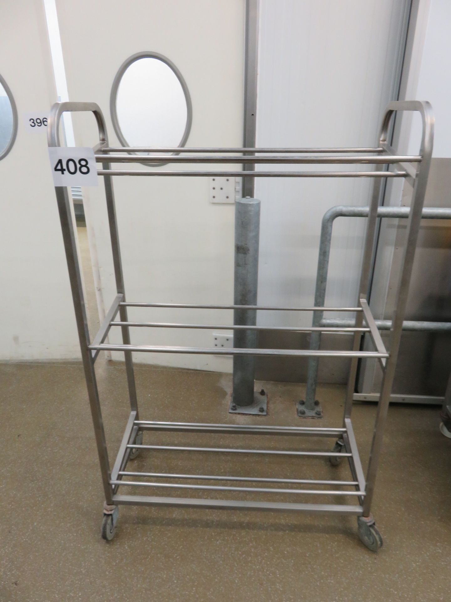 S/s Shelf. 3 shelves 950mm x 400mm x 1500mm high mobile on wheels. Lift out charge £10