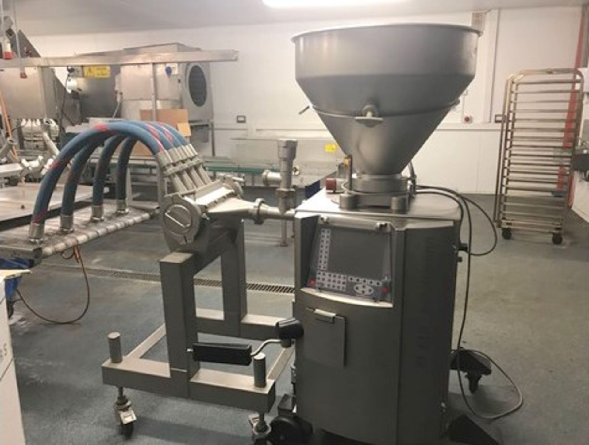 samosa 610 vacuum filler with 4 lane depositor and wire mesh conveyor.LO£150