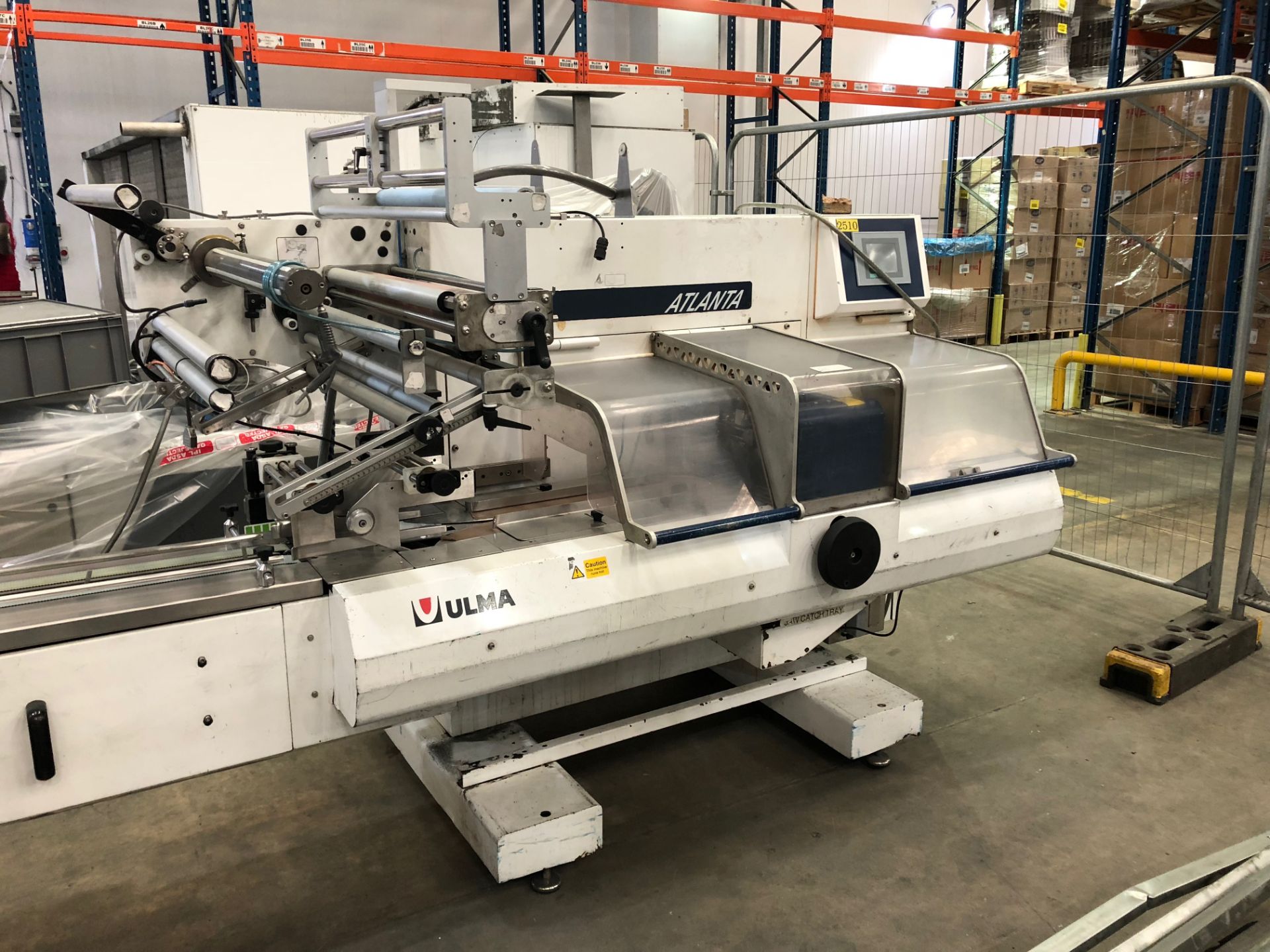 Ulma Atlanta Flow-wrapper with phase feeder, carry over system.PEC for pre printed film Lift Out £80