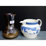 A Lancastrian pottery lustre vase, together with a blue and white pressed ware vase with Hunting