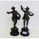 Two patinated Spelter male figures, one of a Hunter, both on circular socle bases, 30cm high, (2)