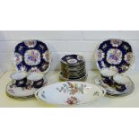 A porcelain teaset with floral sprays and a blue ground comprising eleven cups, twelve saucers,