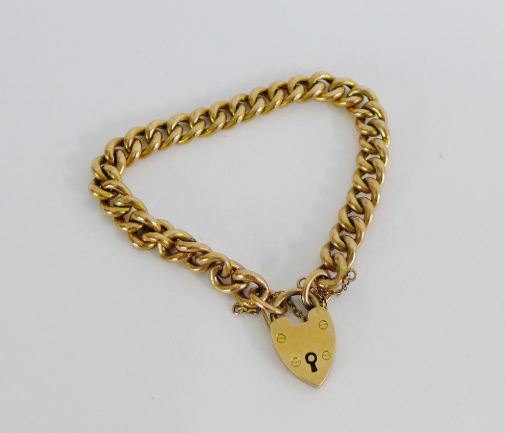 9 carat gold curb link bracelet with 9 carat gold heart shaped padlock