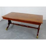 A cherrywood coffee table on lyre end supports and turned stretcher,