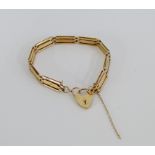 9 carat gold gatelink bracelet with heart shaped padlock, stamped 9ct