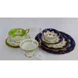 Royal Doulton porcelain, a floral patterned trio together with a matching cake plate and a