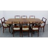 A mahogany twin pedestal dining table, complete with extra leaf together with a set of eight