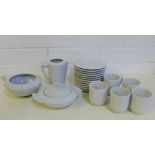 A quantity of Limoges white glazed tea wares to include cups, saucers, milk jug and sugar bowl