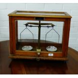 A Goodbrand & Co Ltd oak cased balance scale