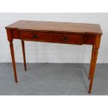 A cherrywood hall table, with two drawers to the frieze, on turned tapering supports, 77 x 102cm