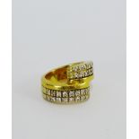 A diamond set dress ring on a yellow metal band UK ring size K