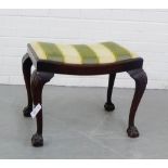 A mahogany stool with upholstered seat and raised on shell carved legs with claw and ball feet ,