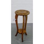 A carved side table with circular top and undertier, 62 x 30cm