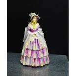 A Royal Doulton porcelain figure 'A Victorian Lady' HN739, with printed and painted backstamps, 20cm