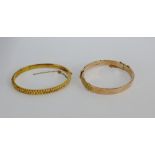 9 carat rose gold buckle bangle together with a 9 carat gold rope twist effect bangle (2)