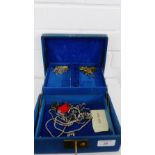 A blue leather jewellery box containing costume jewellery, etc