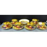 An Aynsley porcelain fruit patterned set of six cups and saucers, signed N.Brunt, together with an