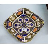 A Royal Crown Derby 'Imari' patterned dish on four small pierced feet, with printed backstamps and