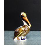 A Royal Crown Derby 'Imari' patterned paperweight in the form of a Brown Pelican with gold