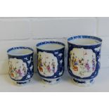 A group of three graduated canton enamelled porcelain tankards with painted panels of figures