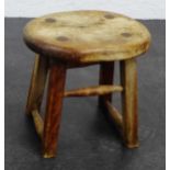 A small rustic wooden milking stool, 34 x 36cm