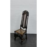An oak cane back hall chair, with carved toprail, 135 x 47cm