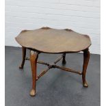 An elm table with circular lobed top on cabriole legs and pad feet, 45 x 76cm