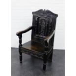 A dark oak Wainscott style chair with carved back and solid seat on baluster turned supports, 103