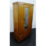An early 20th century oak single door wardrobe with carved panels, 192 x 102cm