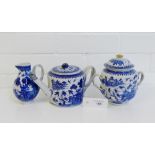A Chinese blue and white teapot, sparrow beak jug and twin handled jar and cover, tallest 15cm, (3)