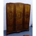 A burrwood veneered triple door wardrobe, 138 x 154cm