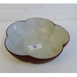 A Chinese circular lobbed flowerhead bowl with a crackle glaze to the interior on a circular