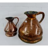 A four gallon copper jug, together with another smaller jug, (2)