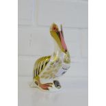 A Royal Crown Derby 'Imari' patterned paperweight White Pelican No. 833/5000 with a gold stopper,