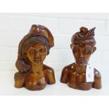 A pair of Balinese style wooden carved male and female head and shoulders figures, 26cm high, (2)