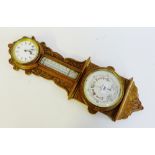 An oak cased barometer and clock, 59cm long