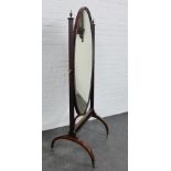 A mahogany framed cheval mirror, the side supports with brass urn finials, 170 x 68cm