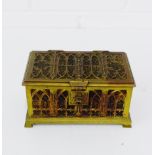 A brass Gothic style casket with a hinged lid and a velvet interior, 16 x 8cm