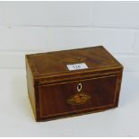 A mahogany and inlaid tea caddy with shell paterae to the lid and front with a lead lined