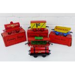 A collection of Hornby Series Gauge O tin plate wagons to include Meccano rotary tipping wagon,