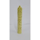 A carved bone container with lotus flower finial to the lid, 16cm long