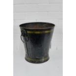 A 19th century fire bucket with lion ring and mask handles to side